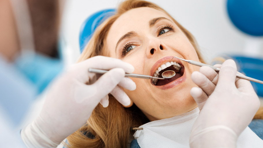 Woman Having Dental Cleaning in Clive