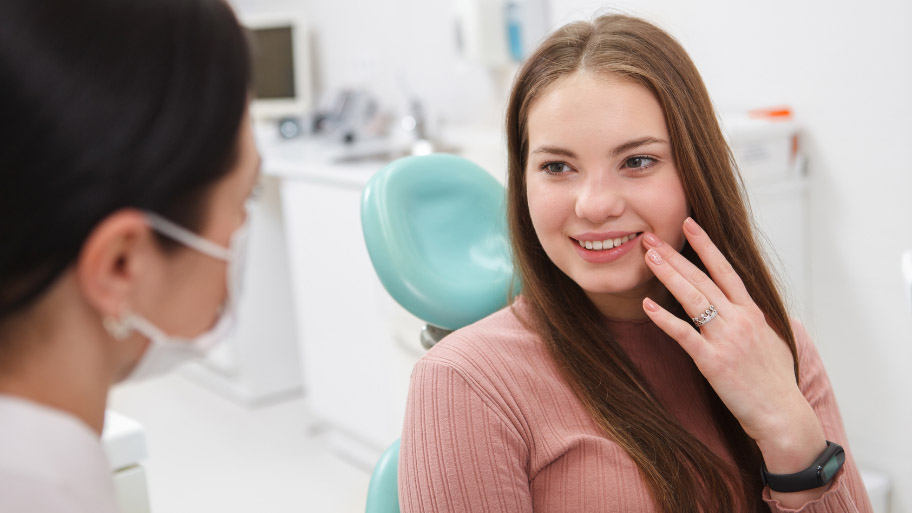 Woman Wondering What Happens At Your First Dental Appointment