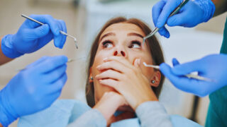 Woman figuring out How to Deal with Dental Anxiety