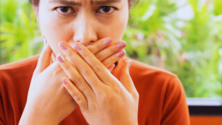 Woman Thinking About Bad Breath Solutions