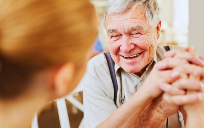 Old Man Happily Talking to a Dentist - Dental Care for Seniors